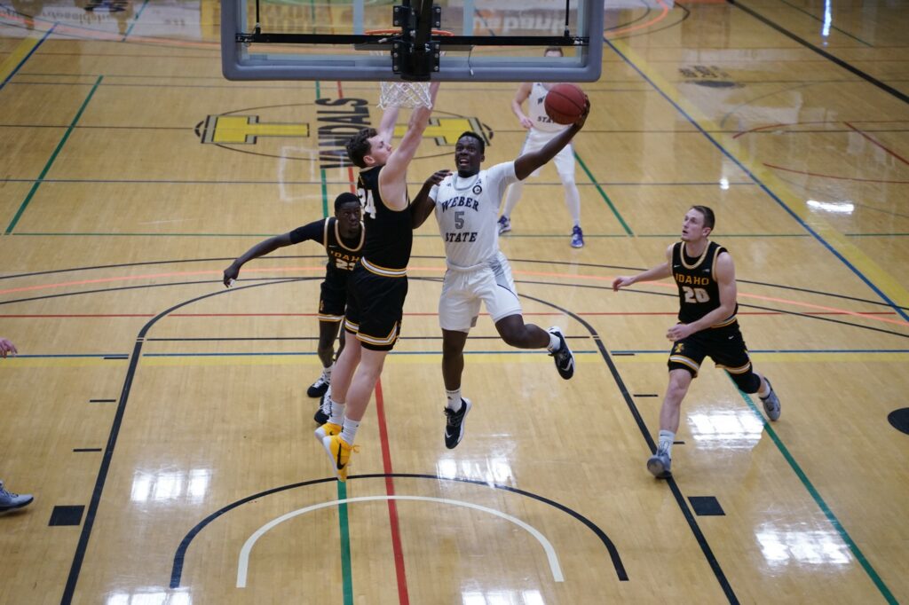 Weber State number 5 goes for a basket while