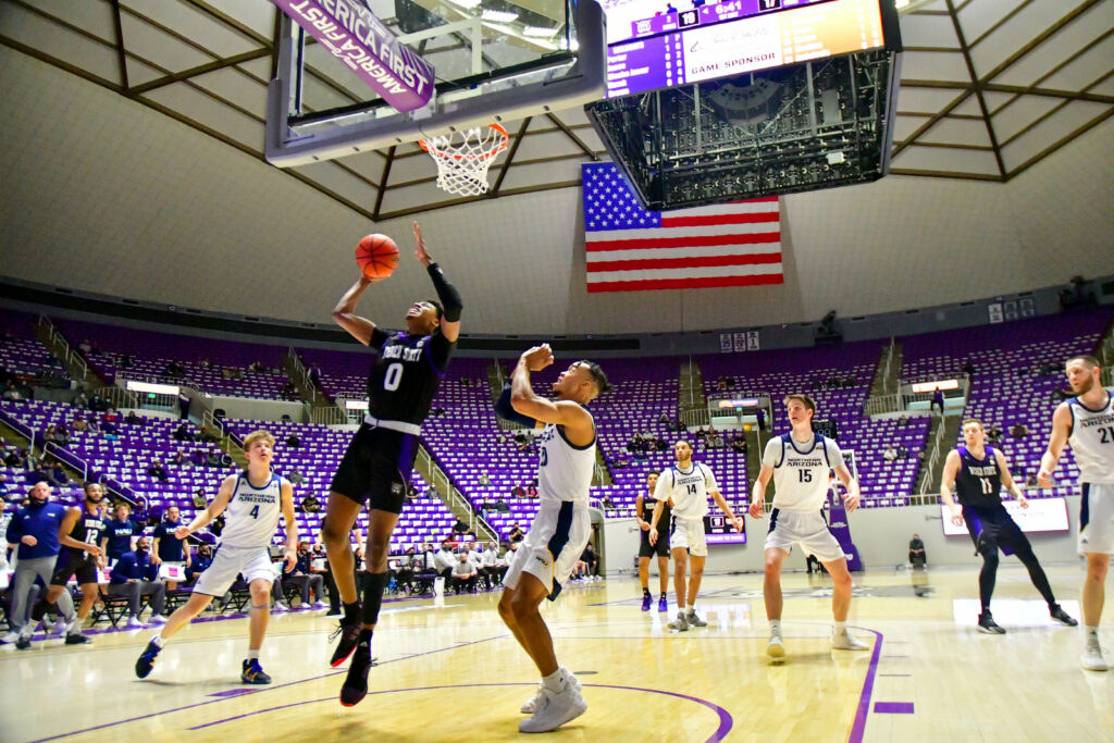 Weber State's Zahir Porter with a layup, gaining 2 points in Saturday's game against Northern Arizona.  (Nikki Dorber / The Signpost)