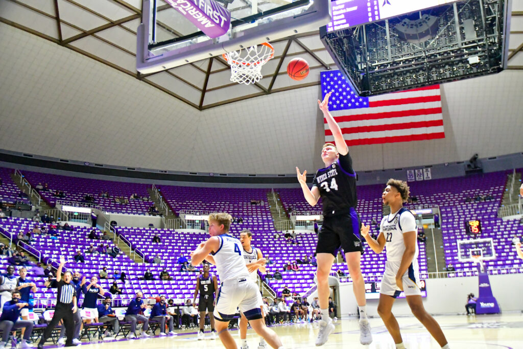 Weber State's Cody Carlson shoots in a two point basket in Saturday's game against Northern Arizona.  (Nikki Dorber / The Signpost)