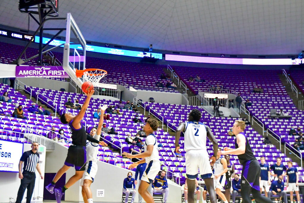 Weber State's Zahir Porter with a layup, gains 2 points in Saturday's game against Northern Arizona.  (Nikki Dorber / The Signpost)