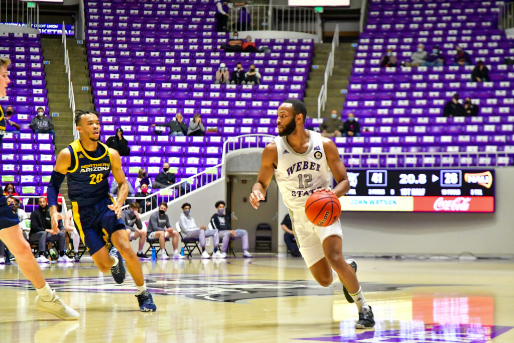 Isiah Brown, number 12, contributed to many of the threes on Thursday night.  Brown is the MVP of the game.  (Nikki Dorber / The Signpost)