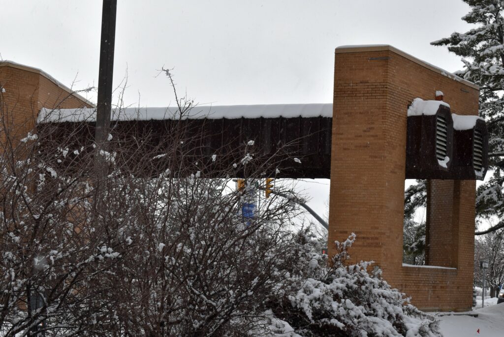 Snow covers the Dee Events Center Marquee at Weber State University before demolition begins in March. (Paige McKinnon/The Signpost)