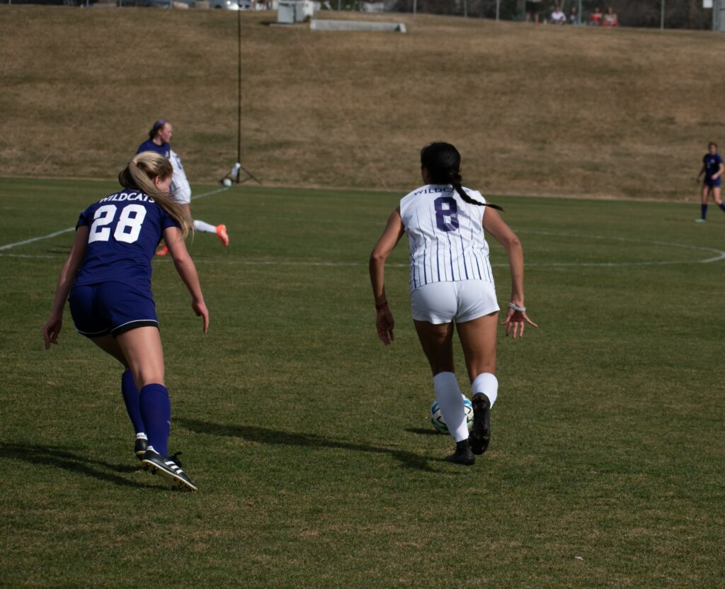 Jersey number eight take the ball down the field at Weber State University on March 19. (Paige McKinnon/The Signpost)
