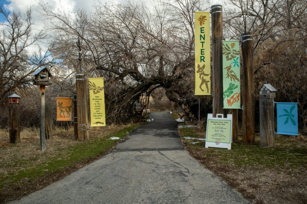 The entrance to Ogden Nature Center's trail which leads to their main building. Birdhouse stands just off the trail at Ogden Nature Center's trail to their main building. Each year, the Nature Center displays birdhouses from their annual competition. (Sarah Earnshaw/ The Signpost)