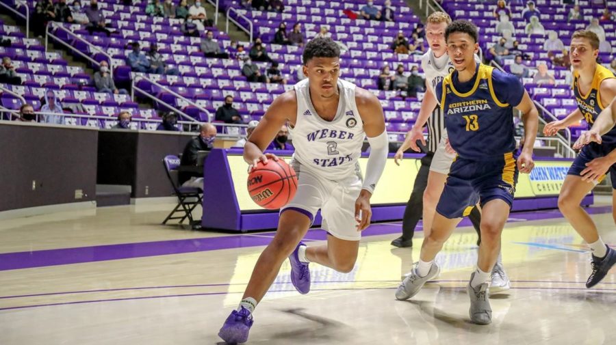 WIldcats forward Dillon Jones driving to the basket against NAU. Photo credit: Weber State Athletics
