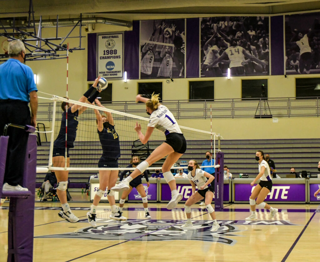 Weber State outside hitter (1) Rylin Adams spikes the ball against Montana State on Saturday, March 20, 2021 at Swenson Gym in Ogden. WSU wins the game, making them the Big Sky champions for the first time in Weber State history. Nikki Dorber/The Signpost