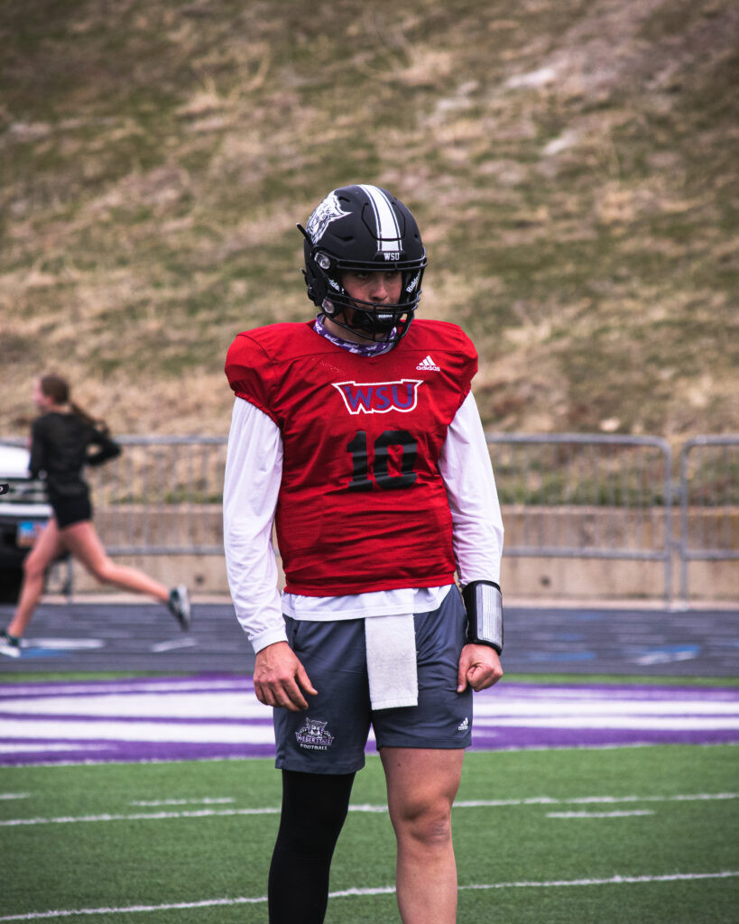 Wildcat quarterback Bronson Barron stands during practice at Stewart Stadium.