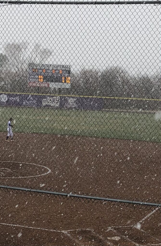 The Wildcat Softball Field scoreboard's illuminated minutes before the game against Utah State was canceled in Ogden on March 23.