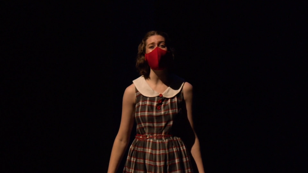 Abigail Philpott performs “First You Dream” solo at the Weber State University Theatre musical “Crushing the Curve: Behind the Curtain” while wearing a mask due to COVID-19 safety restrictions. (Abdulrahman Almohammadi / The Signpost)