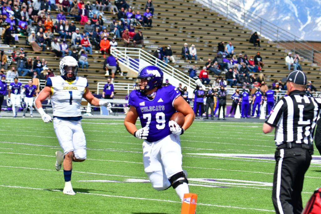 Wildcat O-lineman Noah Atagi running into the end zone for WSU's second touchdown vs. Northern Arizona on March 27 at Stewart Stadium.