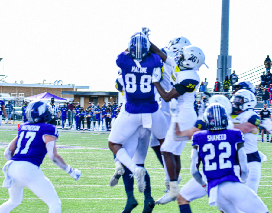 With two seconds left in the game, Weber State Universitys tight end Justin Malone, 88, catches the Hail Mary pass for the win against Northern Arizona on Saturday, March 27. (Nikki Dorber/The Signpost)