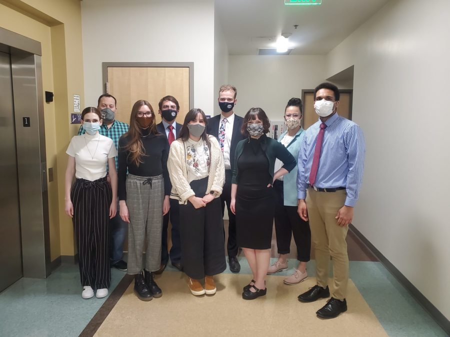 Members of the WSU Speech and Debate team wear masks for a group photo. Courtesy of Kayla Griffin.
