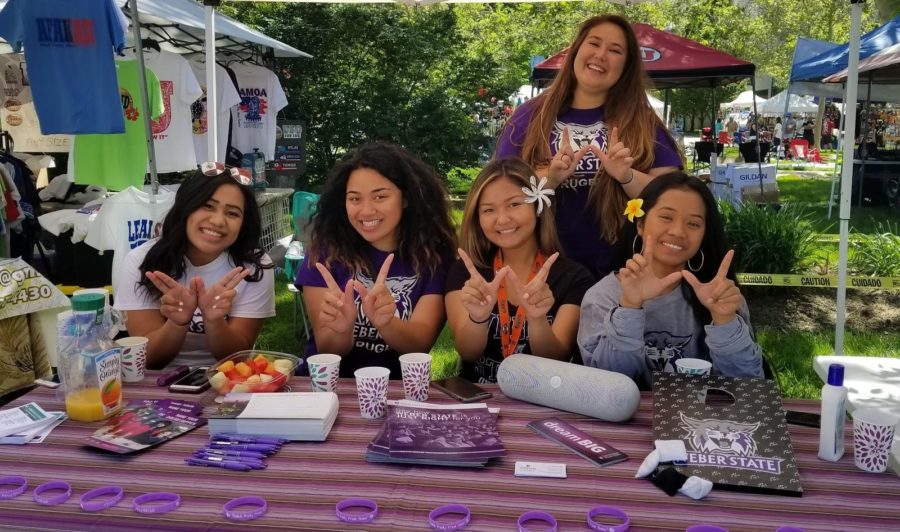 Members of The Ohana Association managing a booth about the organization. Photo credit: The Ohana Association