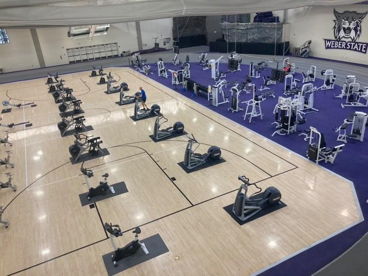 Exercise machines are set up on a basketball court in Swenson Gym at the Stromberg Complex. Photo credit: Matthew Barker, Stromberg Complex Facility Manager
