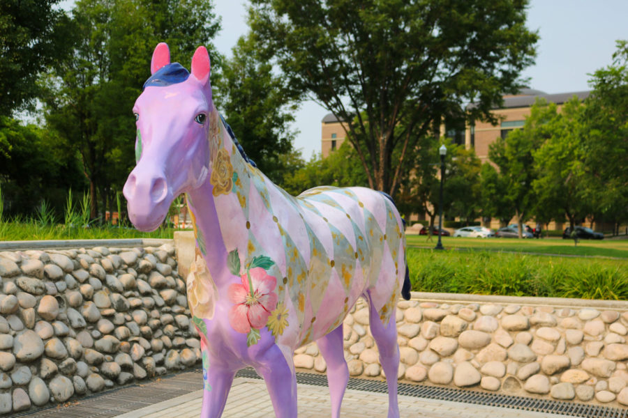 The Friends Forever horse utilizes bright colors and flowers to catch the attention of all who walk by. (Bella Torres / The Signpost)
