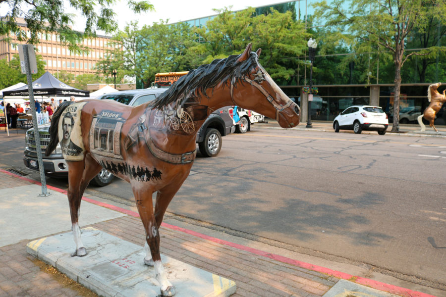 Junior Layton High School student Michel Collins, a fifteen-year cancer survivor, is the artist behind Wanted. Wanted is one of the many horses located along 25th street in Downtown Ogden. (Bella Torres / The Signpost)