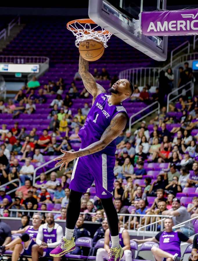 Damian Lillard slams down his signature dunk at to the delight of the Dee Events Center crowd on Aug. 20. Photo credit: Weber State Athletics