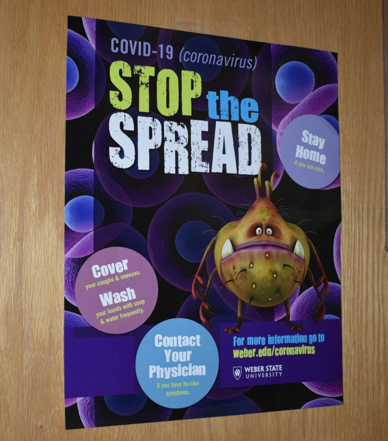 Stop the Spread poster found on the door of the Student Health Center, which offers vaccines for students on campus.  (Paige McKinnon/The Signpost)