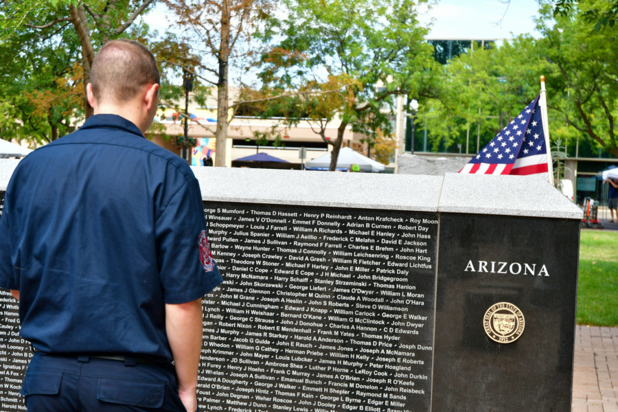 A young cadet reads the names of his fallen brothers and sisters at the Sept. 11 memorial in Ogden. (Nikki Dorber/The Signpost)
