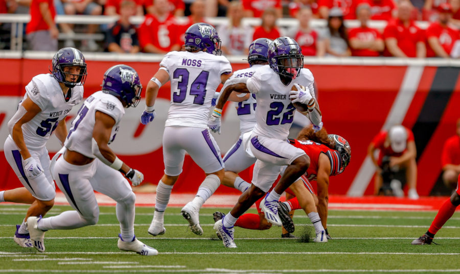 Senior wide receiver Rashid Shaheed, 22, bolts into the open field on his record-breaking sixth career kickoff return at Rice Eccles Stadium on Sept. 2. Photo credit: Weber State Athletics