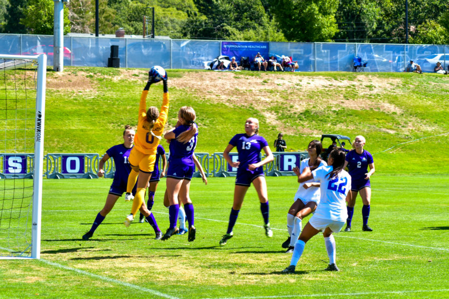 Mekell Moss, the Wildcats goalie, jumps high alongside her team to defend against a Highlander goal. (Nikki Dorber/The Signpost)