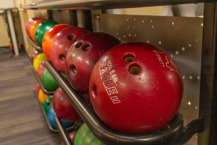 Multiple racks carry bowling balls that are available to students who want to bowl in the Shepherd Unions bowling alley. (Kennedy Robins/ The Signpost)