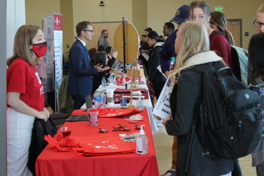 Students interested in the medical field have a chance to ask questions about employment opportunities offered within the fair.  (Lisa Rajigah/The Signpost)