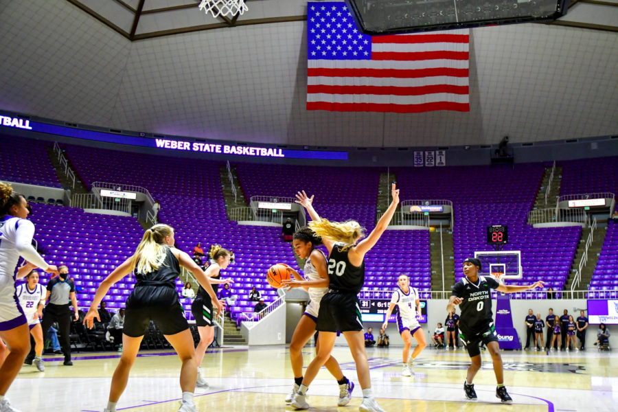 Weber States Daryn Hickok, 21, fights her way to the basket in the Nov. 9 game at WSU against North Dakota. Photo credit: Nikki Dorber