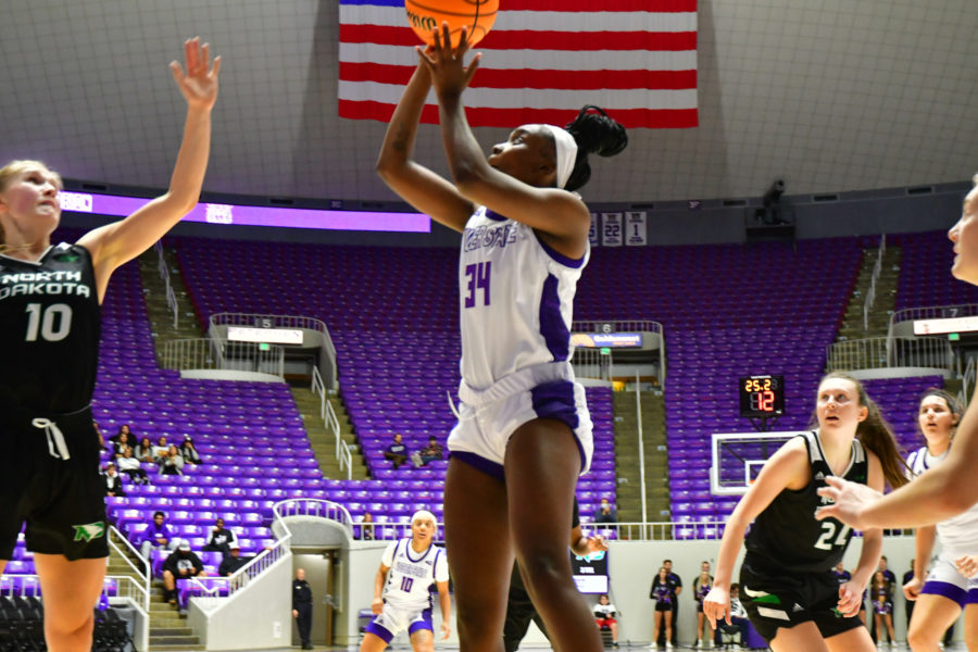 Nakilah Johnson, 34 goes in for a 2-point basket on Nov. 9 as the WSU womens basketball team hosts North Dakota for their opening game in Ogden. Photo credit: Nikki Dorber