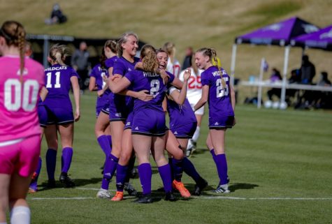 The soccer team comes together for a celebration. Photo credit: WSU Athletics