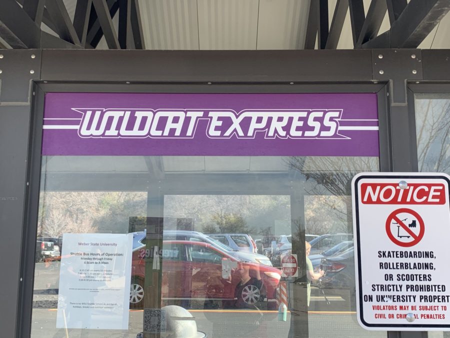 The Wildcat Express logo on the bus shelter in the Dee Events Center parking lot. Photo credit: Marisa Nelson