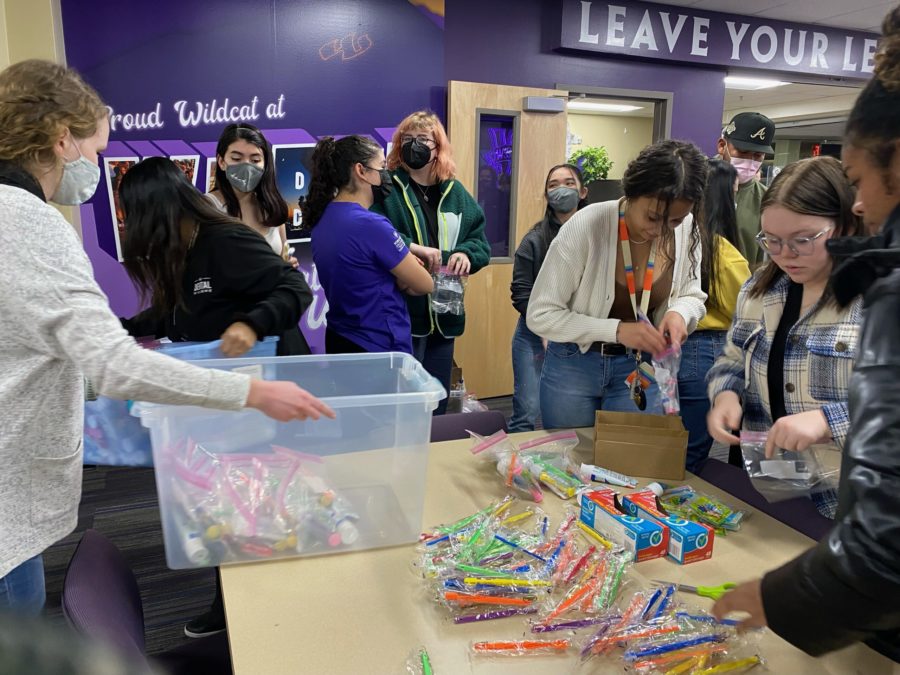 Student volunteers assemble dental hygiene kits. Photo credit: Alexandrea Bonilla