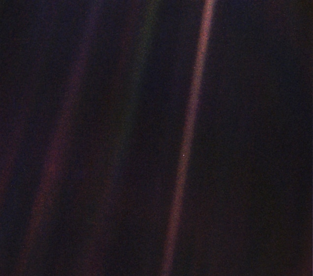 The Earth from a distance of roughly 4 billion miles away, the "Pale Blue Dot"