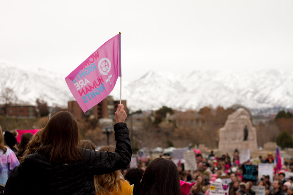 Human rights activists held flags in support during the march. (The Signpost Archives)