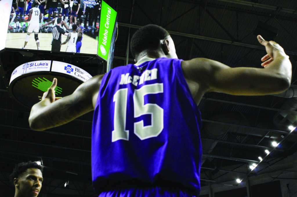 No. 15 (Koby McEwen) hypes up the crowd. (Camryn Johnson/ The Signpost)