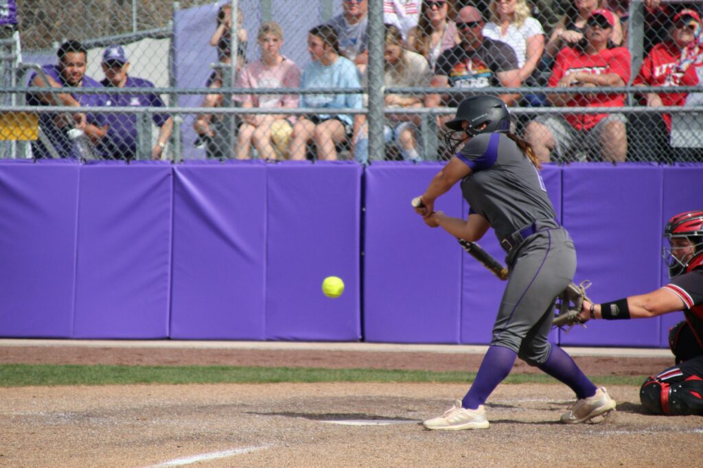 Weber State's Mika Chong goes to hit the softball. (Summer Muster/The Singpost)