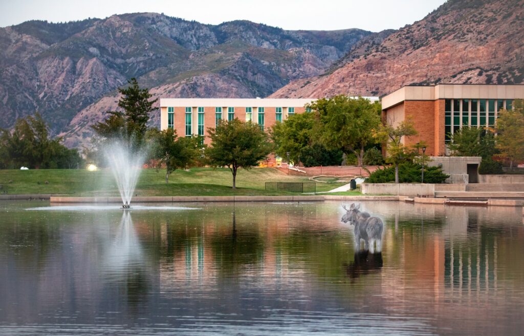 The ghost of Hank the moose wades in the WSU pond. Photo by Benjamin Zack, edited by Kennedy Robins. (Kennedy Robins/ The Signpost)