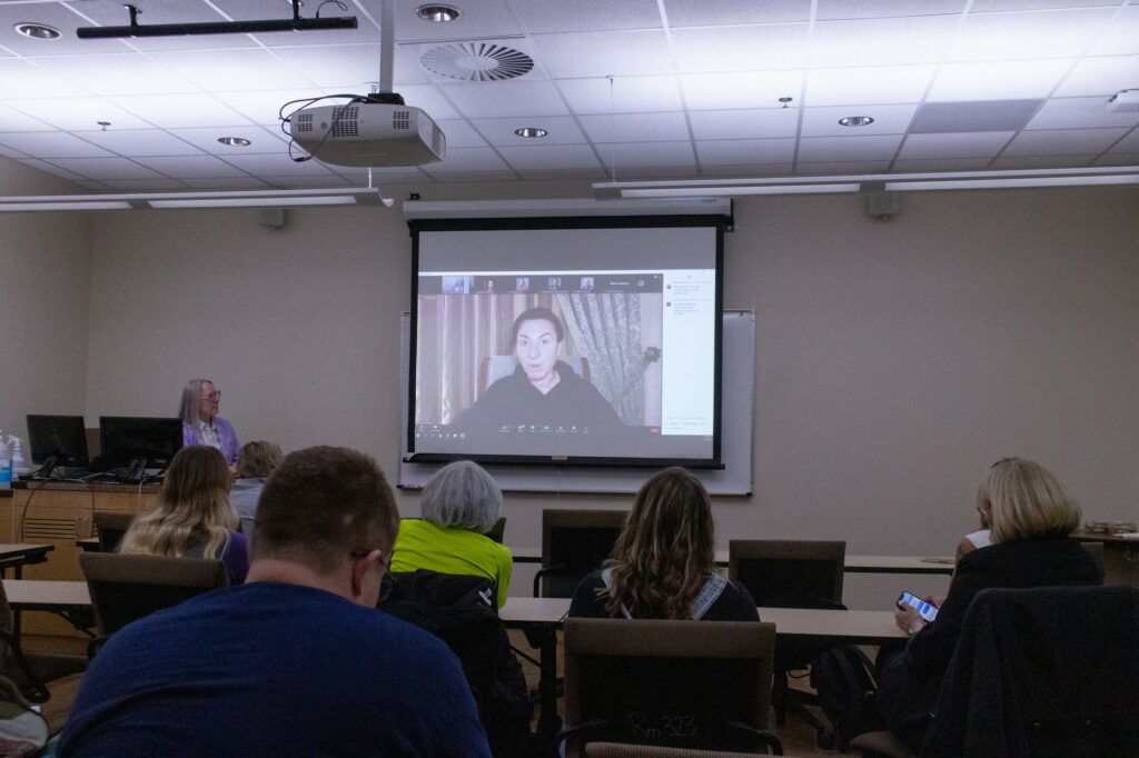 Lynsey Addario sharing her stories and tips on being a photojournalist in multiple fear-based events. (Kennedy Robins/ The Signpost)