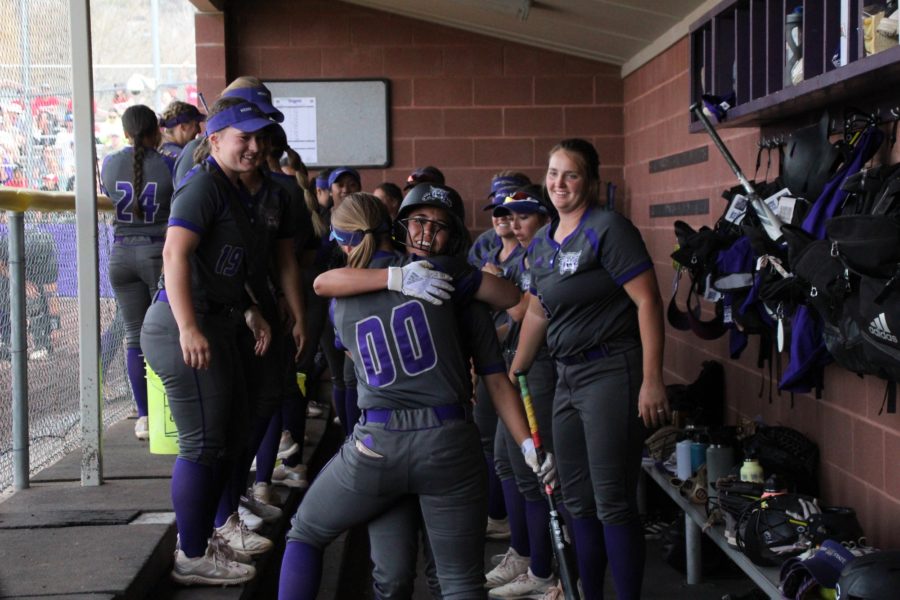 The Weber State softball team celebrates after a home run. Photo credit: Summer Muster