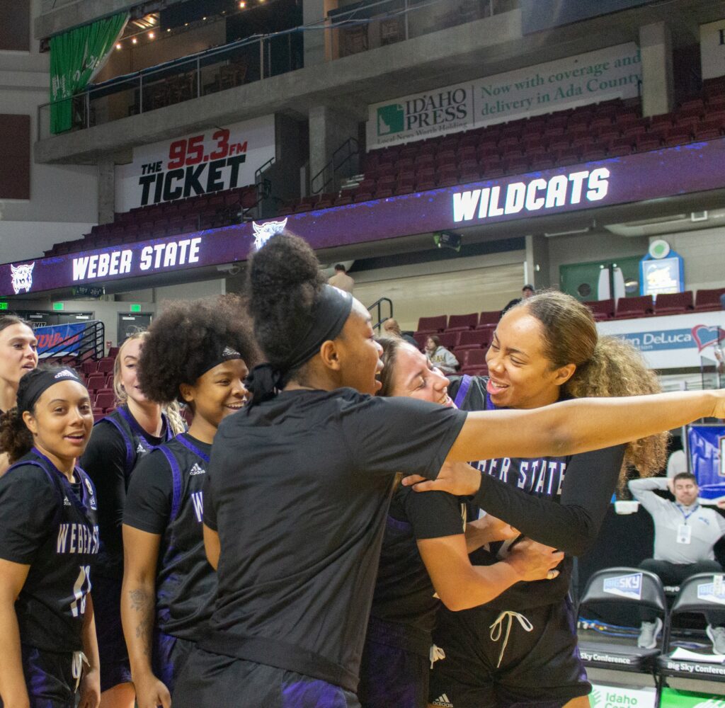 The women's basketball team gathers together after winning their game against Sac State. (Kennedy Robins/ The Signpost)