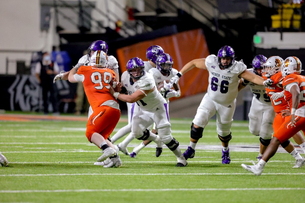 The Weber State offensive line rush to hold back the Idaho State defense. (Weber State Athletics)