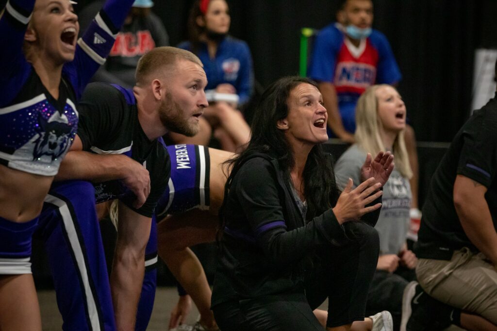 The Weber State University Spirit Squad performs at the Davis Conference Center on August 6, 2021 with Coach Summer Willis cheering them on, front and center.