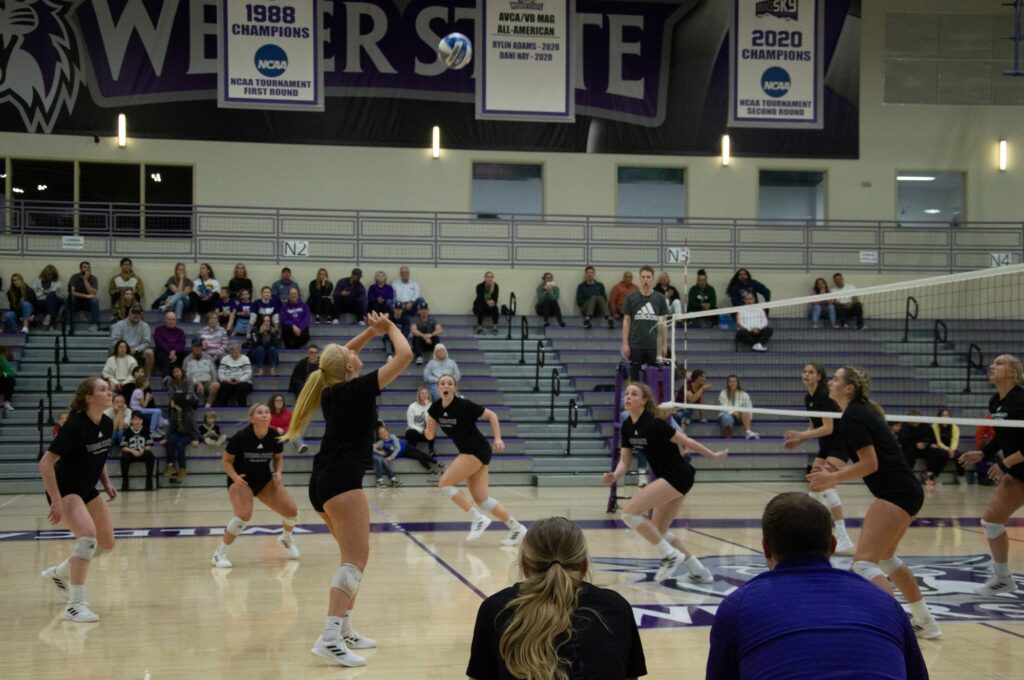 The women's volleyball team prepares to hit the ball after a set was made. (Summer Muster/The Signpost)