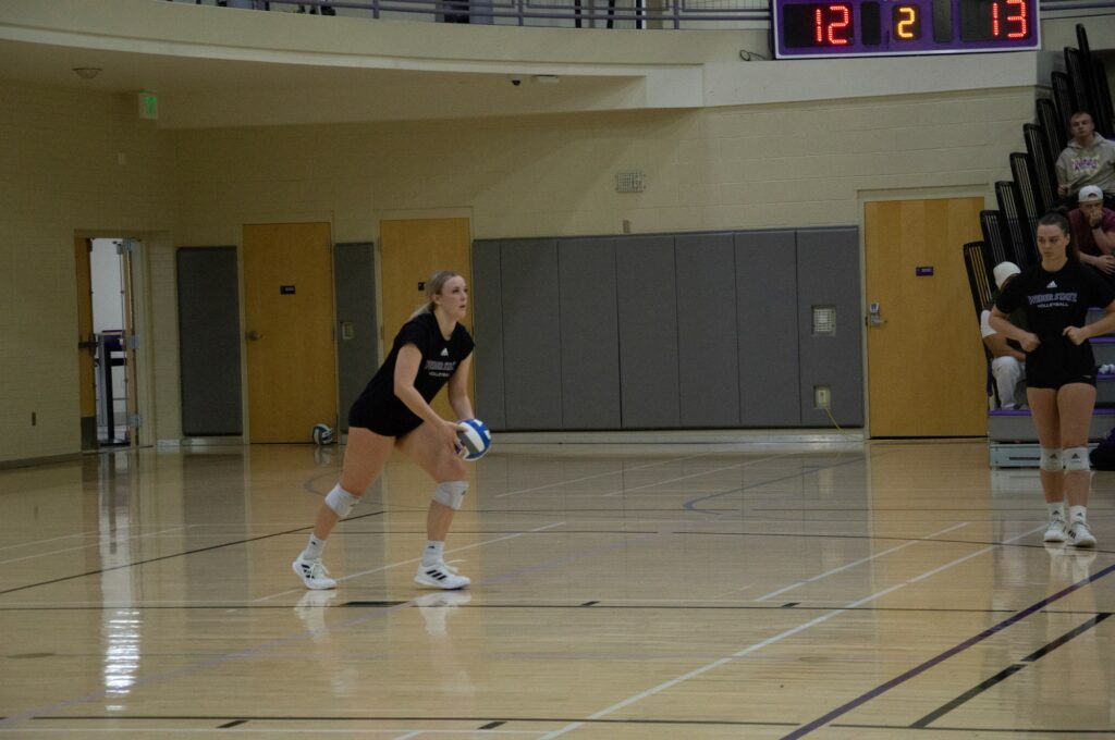 Dani Nay prepares to serve the ball. (Summer Muster/The Signpost)