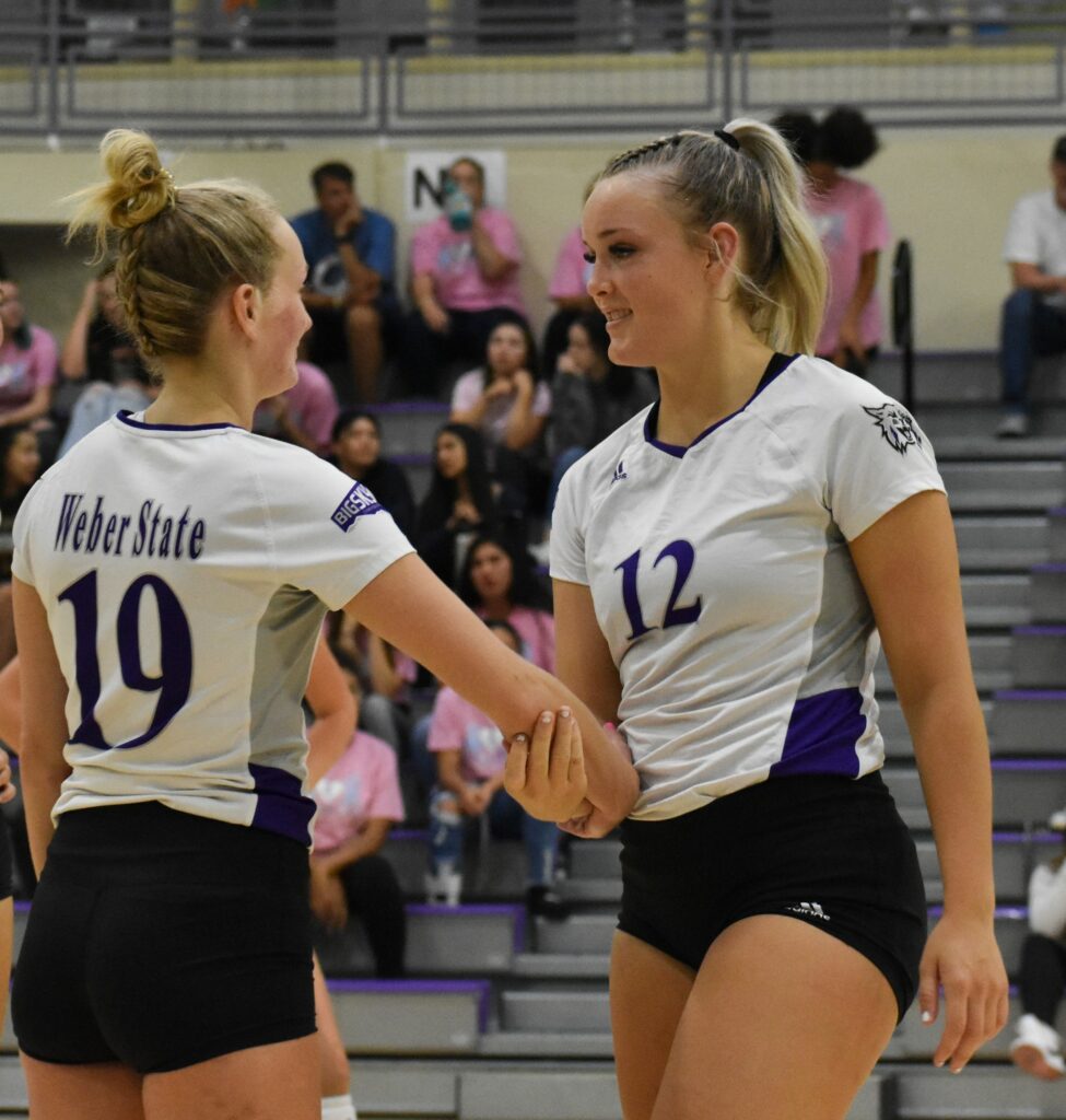 Dani Nay and Ashlyn Power celebrate following a play. (Paige McKinnon/The Signpost)