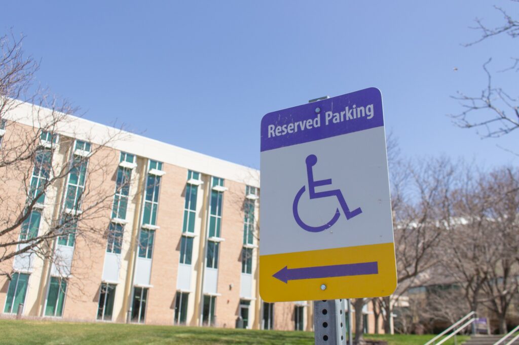 A reserved parking sign with the disabilities parking logo located at the A1 parking lot.