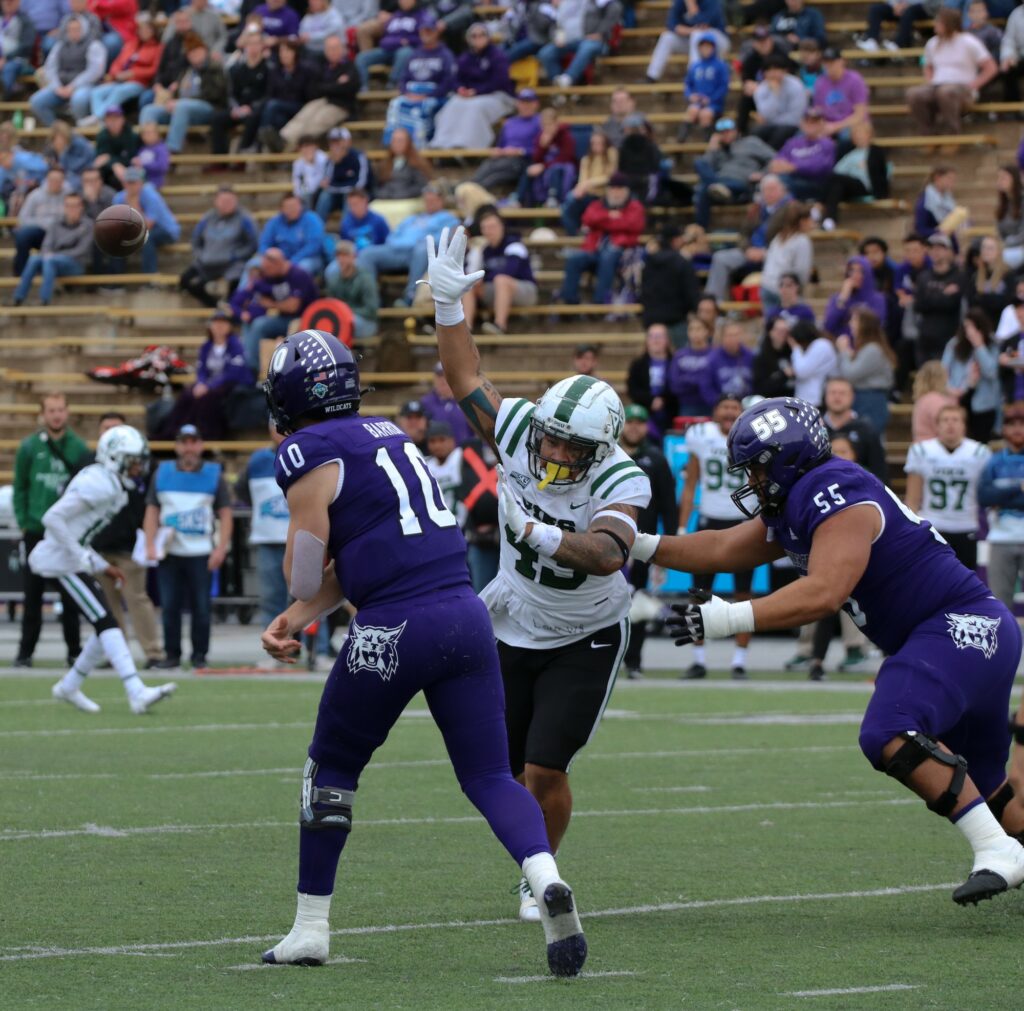 Bronson Barron (#10) rushes the pass as Portland State's defense works for the tackle. (Bella Torres / The Signpost)