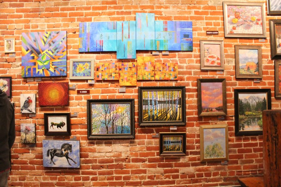 Artworks by B.J. Jensen and Roberta Glidden, as well as many others, are displayed. Photo credit: Hannah Moore