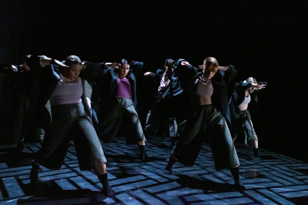 Weber State University Orchesis dancers dancing in "We Move Among the Mass, Again" choreographed by Natosha Washington and Jo Blake.