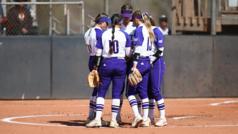 The team gathers in a huddle before the game against ISU. Photo credit: Weber State Athletics